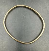 A 9ct gold bangle, approximate weight 18.7g