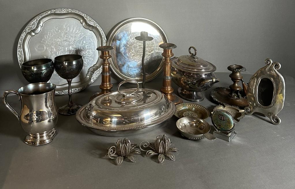 A selection of mixed metal items to include candle sticks, goblets and platters