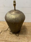 A brass metal effect ribbed table lamp (H50cm)