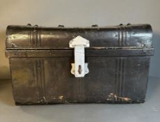 A vintage black painted lockable storage trunk