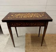 A mahogany swivel top card table with floral marquetry and green baize (H74cm W84cm D43cm)