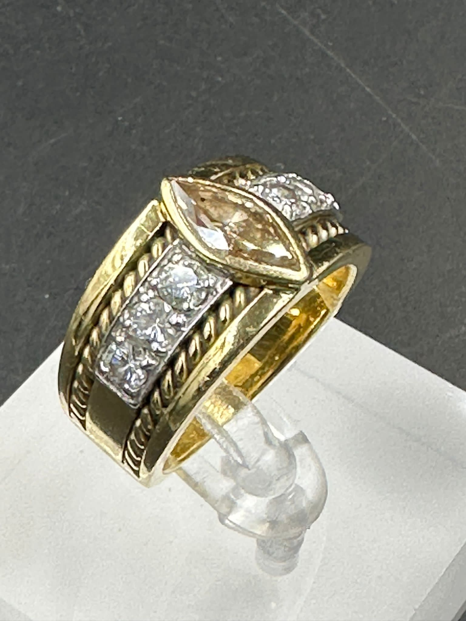 A yellow gold diamond ring with central stone and three separate diamonds to each side . - Image 2 of 3