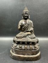 A small Tibetan bronze statue