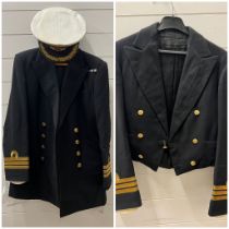 A Royal naval mess dress jacket and naval uniform jacket along with cap