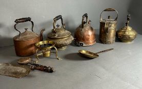 A selection of brass and copper kettles