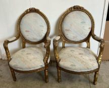 Four gold painted Louis style chairs with scrolling floral upholstery