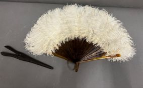A Victorian ostrich feather fan along with a glove stretcher