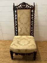 A 19th Century hall/slipper chair with barley twist side supports and pierced back raised on