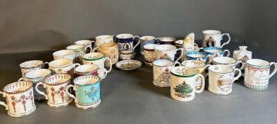 A selection of commemorative ware to include mugs, a pin dish and a lidded pot