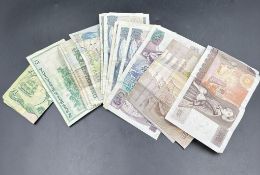 A selection of out of circulation bank notes from the United Kingdom, one £20, eight £10 notes, five