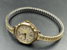 A 9ct, marked 375, gold watch on stainless steel bracelet AF