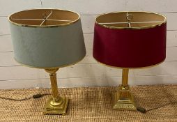 Three Corinthian column table lamps with double arm lights