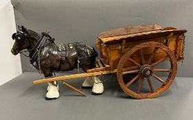 A ceramic horse and cart