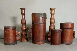 A selection of treen to include graduated measures, tray etc.
