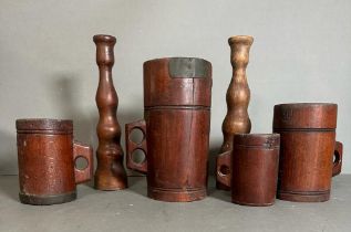 A selection of treen to include graduated measures, tray etc.