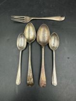 A selection of four hallmarked silver teaspoons and a silver fork, various makers and marks (total