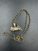 A 9ct gold motorbike pendant on 9ct gold chain