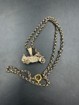 A 9ct gold motorbike pendant on 9ct gold chain