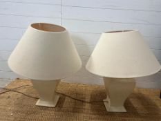 A pair of cream table lamps