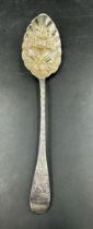 A Georgian berry spoon by T Cox Savory, hallmarked for London 1809