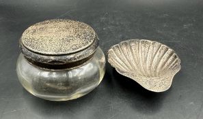 A hallmarked silver lidded glass jar and a hallmarked silver shell