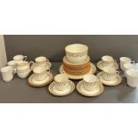 A part tea service by Wedgwood "Strawberry" to include 11 side plates, 6 cups , milk jug, 7 saucers,