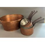 A set of five copper pans and one metal two handle bucket