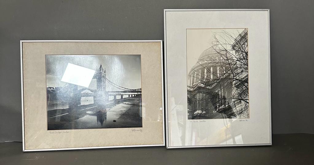 Two black and white framed photographs of London, Tower Bridge and St Pauls both signed lower
