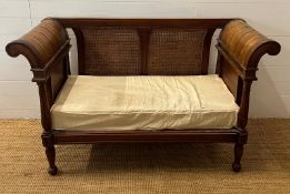 A colonial style caned and carved settee/bergère (H89cm W150 D60cm)