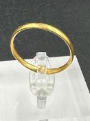 A 22ct gold wedding band (Approximate Total weight 3.2g)