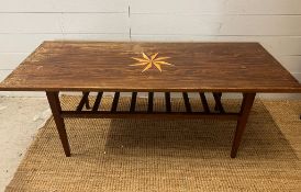 A Mid Century teak coffee table with inlaid star (H46cm W124cm D48cm)