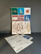 A boxed wooden model kit of a Spanish fishing boat