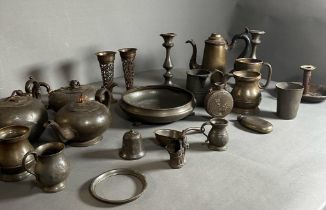 A large selection of pewter items Georgian and later to include candlesticks etc.