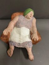 A Clay sculpture of a Housewife unsigned