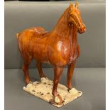 A glazed clay horse sculpture (H50cm W48cm)
