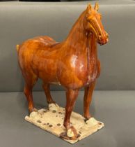 A glazed clay horse sculpture (H50cm W48cm)