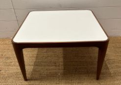 A contemporary square coffee table with Formica top on mahogany frame (H36cm W60cm D60cm)