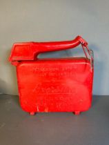 A red 1950's Eversure vintage petrol can