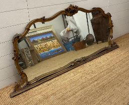 A gilt framed over mantle mirror in the rococo style. Height 75x180