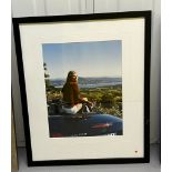 Framed photograph of a lady sat on a Mercedes SLK 2000 (Framed size 48cm x 58cm)