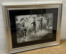 A framed black and white photograph of a 1950's water skiing party 69x49