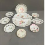 A selection of decorative pierced dishes and handled serving plate. All with a floral or fruit theme