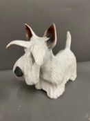 A china model of a Scottie dog (H24cm W30cm)