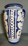 A large blue and white vase with floral pattern