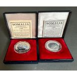 Two 1998 silver coins commemorating the Titanic by the International Currency Bureau.