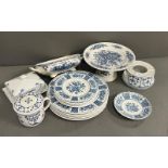A selection of blue and white china to include cake stand, plates, butter dish etc. Various makers
