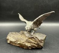 A white metal eagle on polish marble base (Approximate Height 111cm)