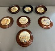 Seven framed porcelain jam pot covers AF