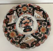 An Imari charger, 19th Century with scalloped 38cm Diameter.
