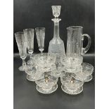 A selection of cut glass decanters, water jugs and stemmed bowls